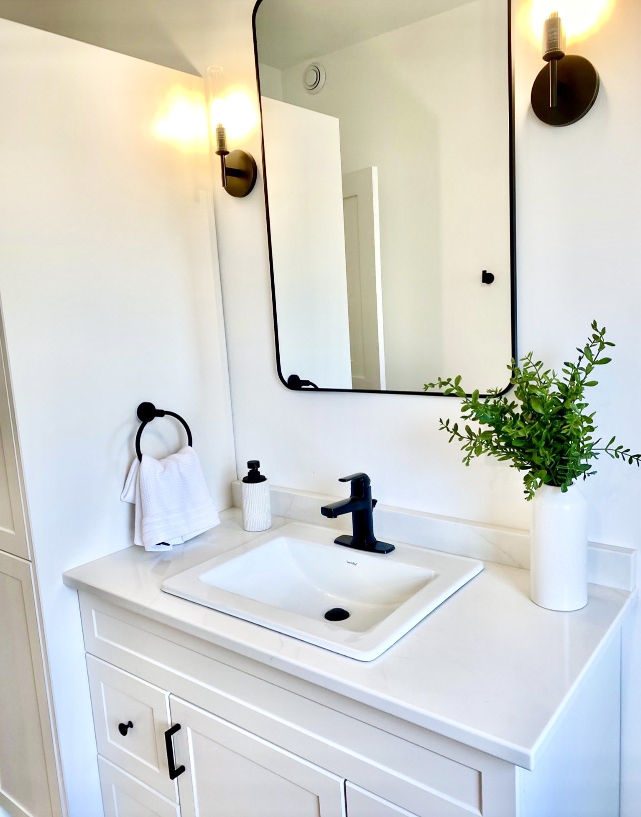 Bathroom vanity with black fixtures